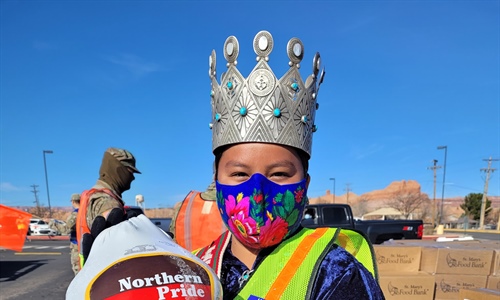 Miss Navajo carrying Turkey