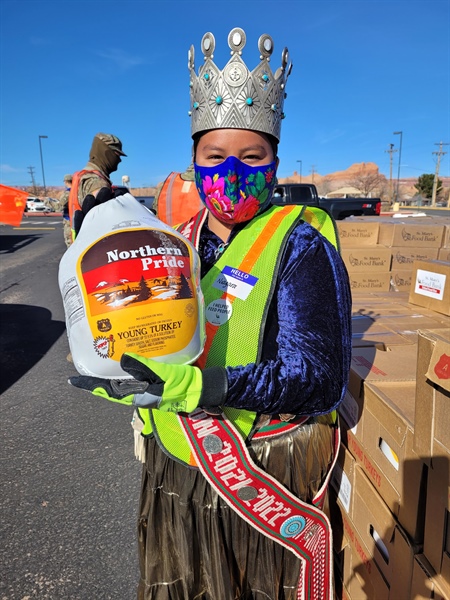 Miss Navajo carrying Turkey